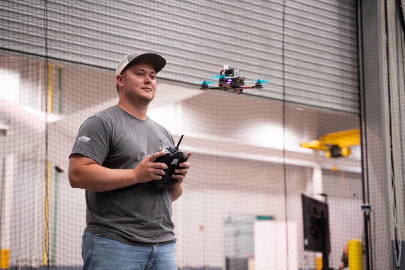 Sean flying a drone