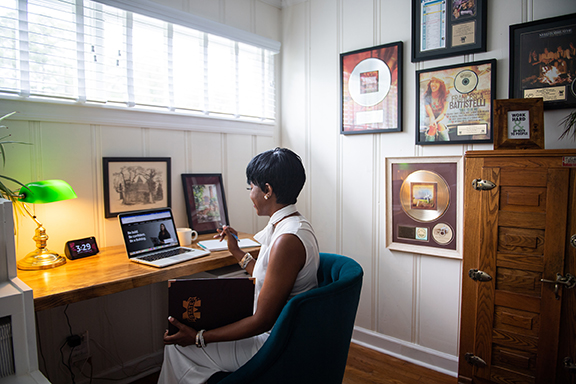 Women sitting at a desk with the MS State Online website open