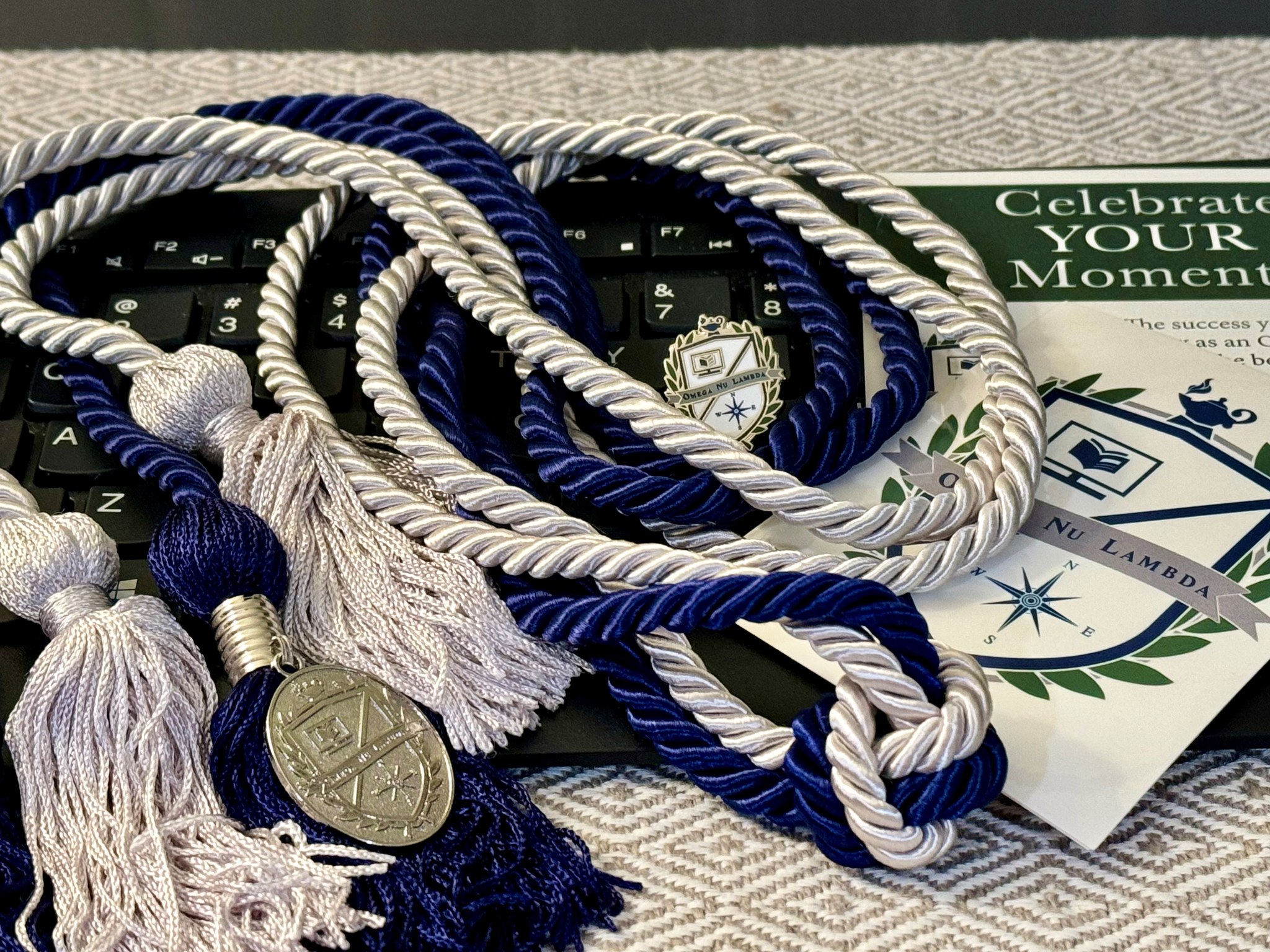 Article hero image of honor society certificate on keyboard